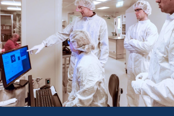 Researchers use instrumentation in the NanoFabrication Kingston lab