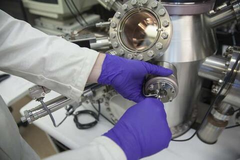 Preparing equipment in the Surface Analysis Lab