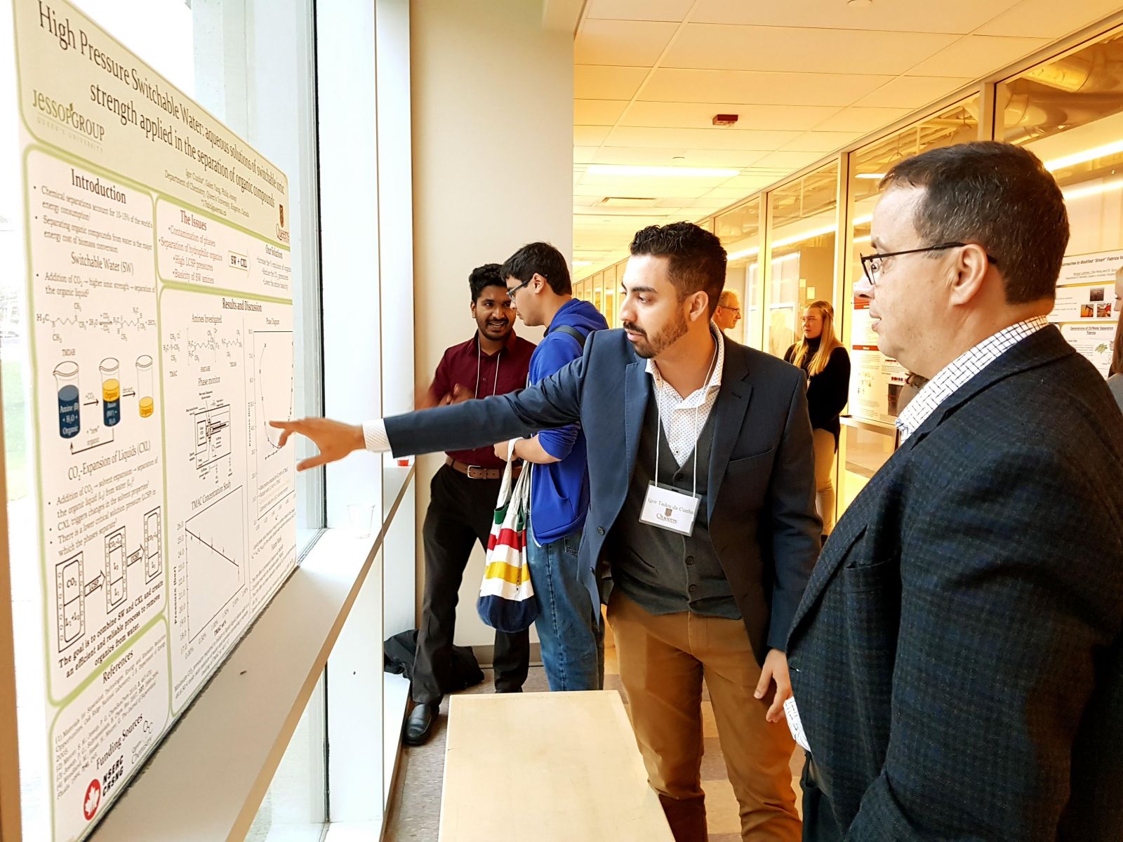 Photo: Student showcasing poster at Queen’s Chemistry Innovation Council event