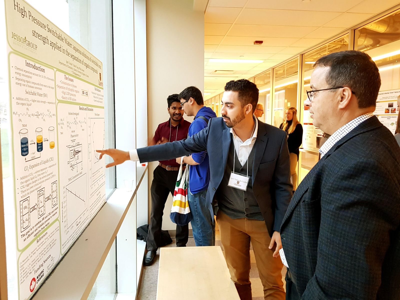 Photo: Student showcasing poster at Queen’s Chemistry Innovation Council event